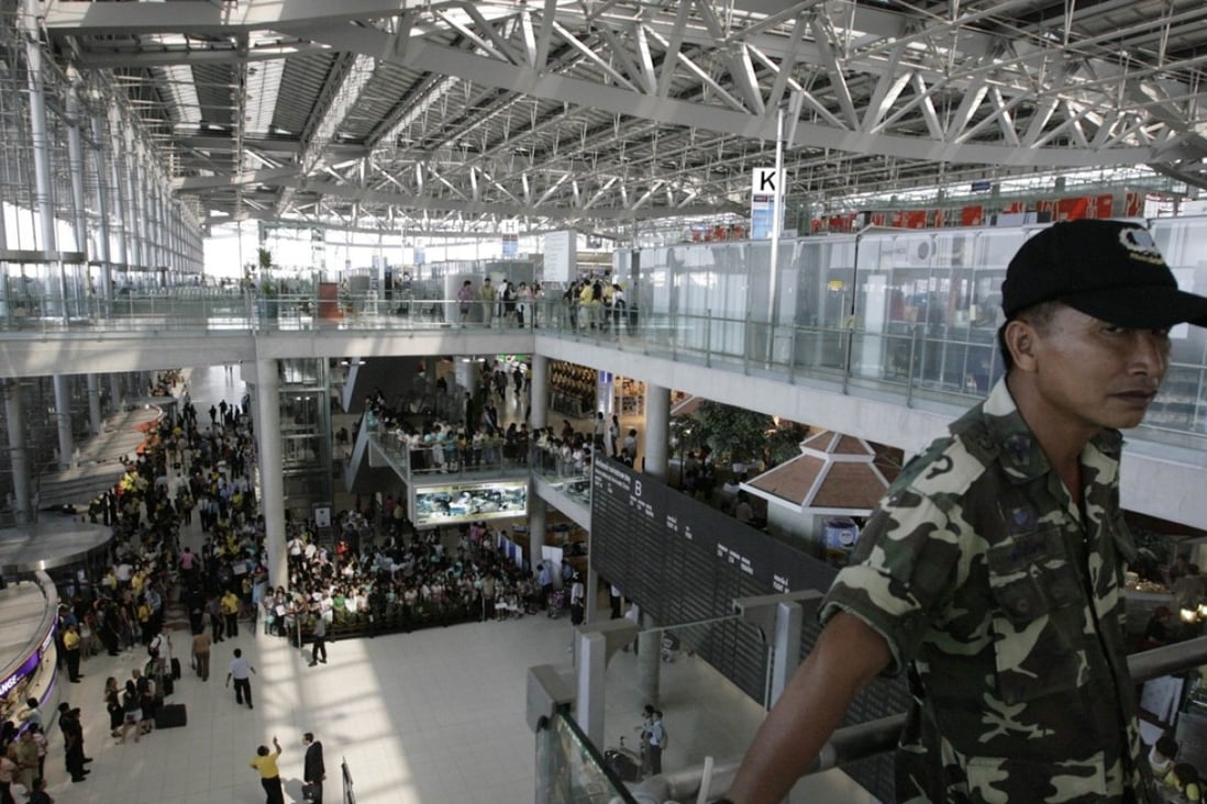 A military police officer stands guard in the departure hall of Bangkok’s Suvarnabhumi airport. Photo: Reuters
