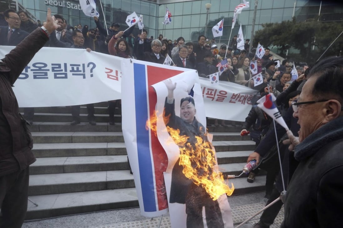 South Korean protesters burn a portrait of North Korean leader Kim Jong-un. Photo: AP