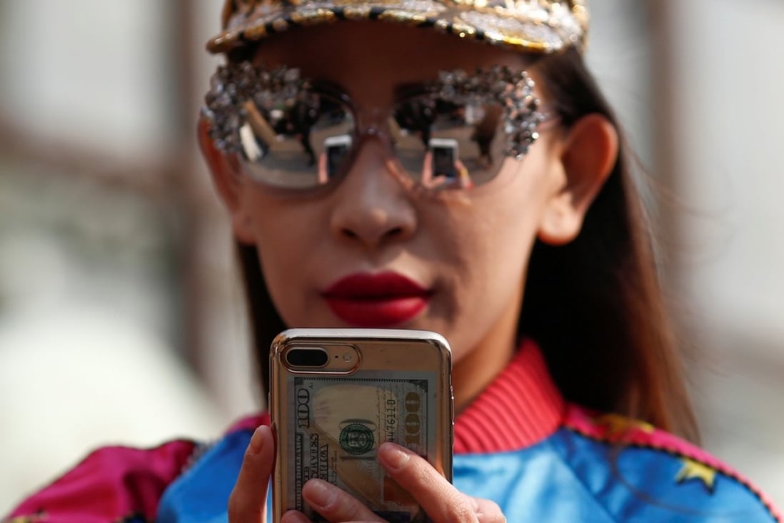 Paying by instalment, with a few taps on the smartphone, is becoming a habit among young Chinese. Photo: Reuters