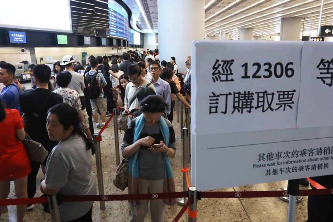 Passengers queuing for tickets at the West Kowloon terminus. Photo: Nora Tam