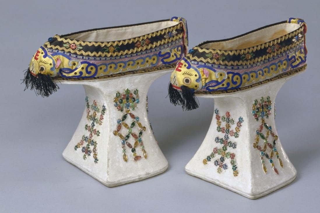 Platform shoes with tiger heads, the character for longevity, and bats from the Guangxu period (1875 to 1908). Appliqué, silk satin; platforms: wood core covered with cotton, glass beads. Photo: courtesy of the Palace Museum