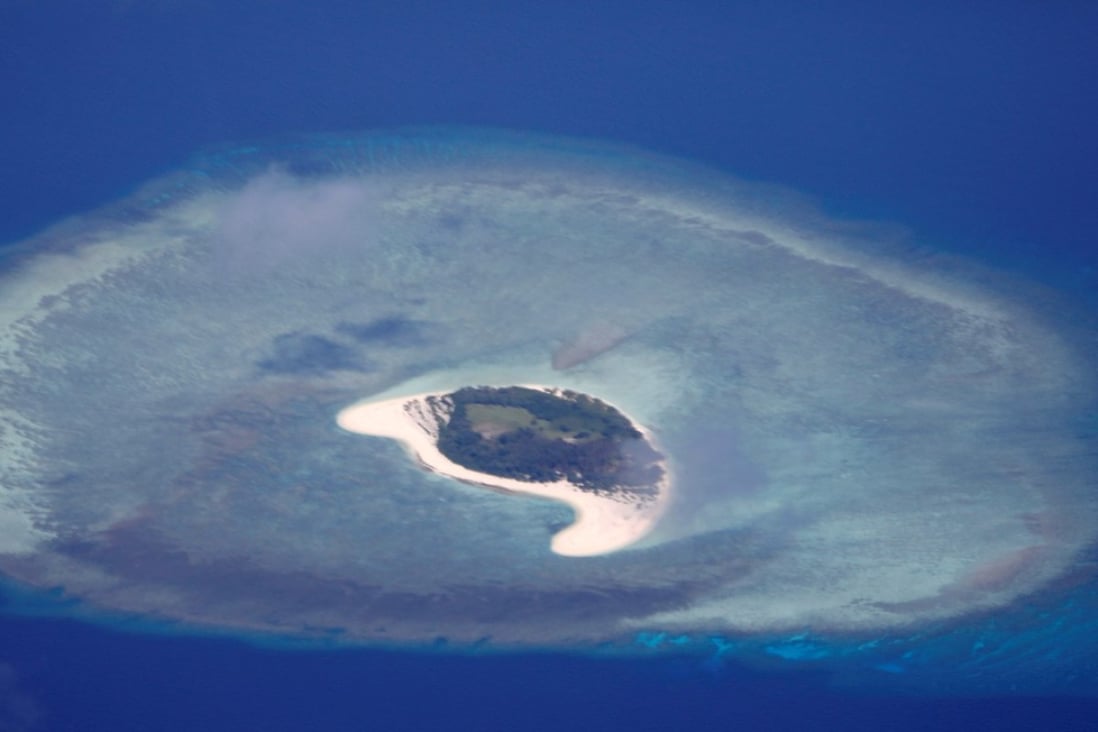 An uninhabited island in the disputed Spratly chain. An American warship passed through waters near the islands on Sunday. Photo: Reuters