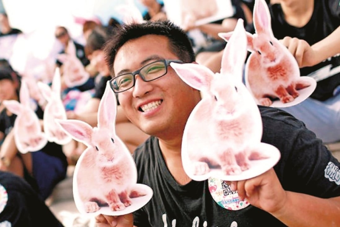Activists show their support for an end to cosmetic testing on animals in China.
