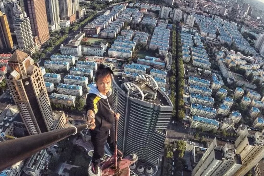 Chinese rooftopping star Wu Yongning posted nearly 300 videos showing his daredevil exploits on buildings across China until he fell to his death from a 52-floor building in Changsha. Photo: 163.com