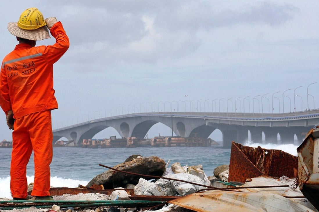 A construction worker looks towards the China-funded Sinamale bridge in Male, Maldives. Photo: Reuters