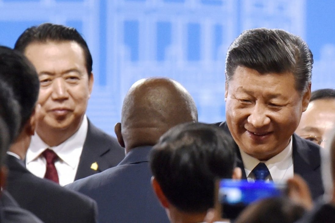 Meng Hongwei and Chinese President Xi Jinping at an Interpol meeting in Beijing in September 2017. Photo: Kyodo