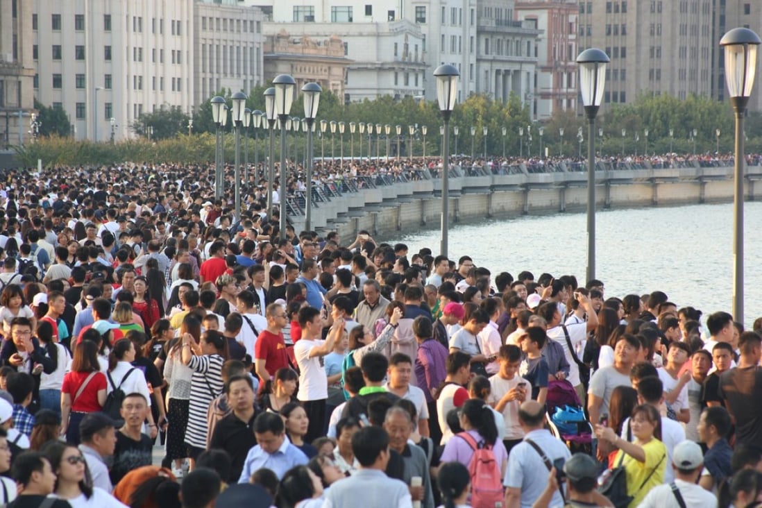 Visitors throng the Bund, Shanghai's iconic waterfront, on the second day of this year’s National Day "Golden Week" holiday in China but consumer spending was slow compared to last year. Photo: Reuters