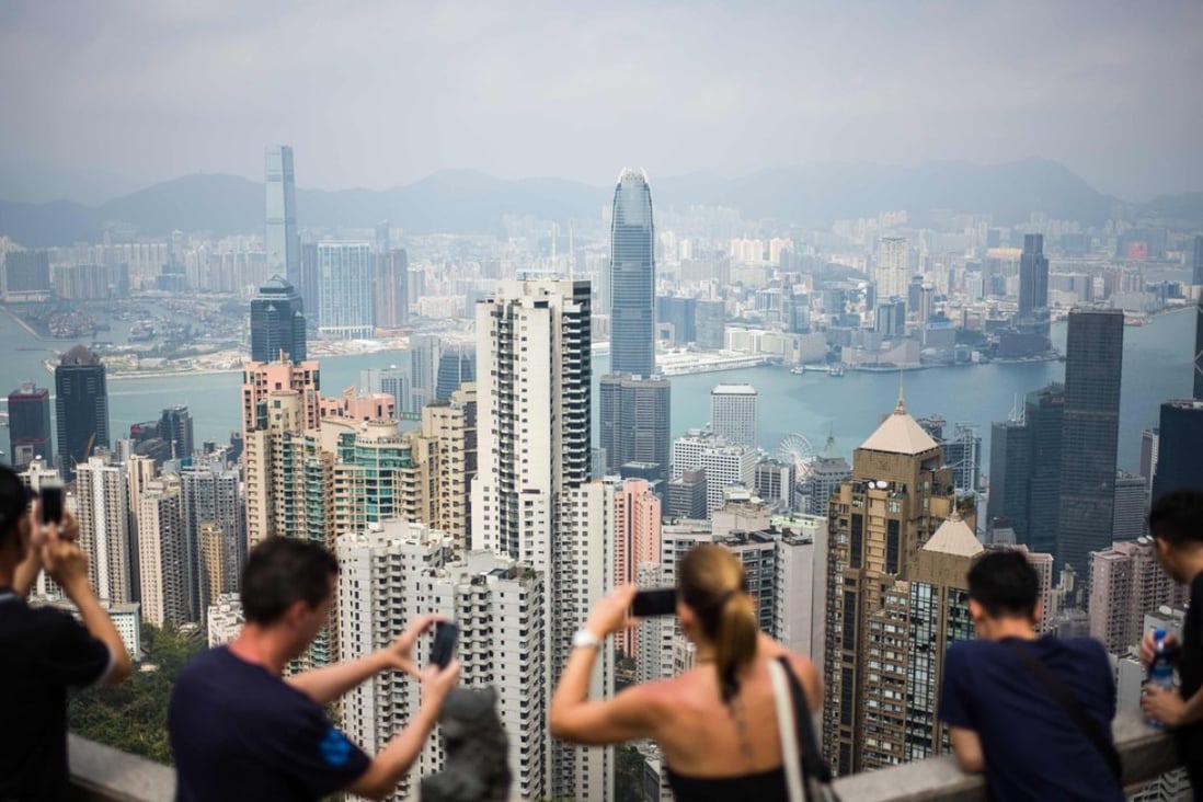 About 15 office buildings in Hong Kong worth more than HK$31 billion were sold to mainland companies, according to CBRE, in the first half of 2018. Photo: AFP