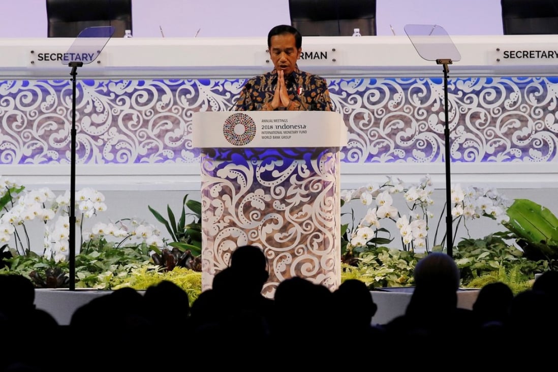 Indonesia President Joko Widodo gestures during a speech at a plenary session at International Monetary Fund – World Bank Annual Meeting 2018 in Nusa Dua, Bali, Indonesia on Friday. Photo: Reuters
