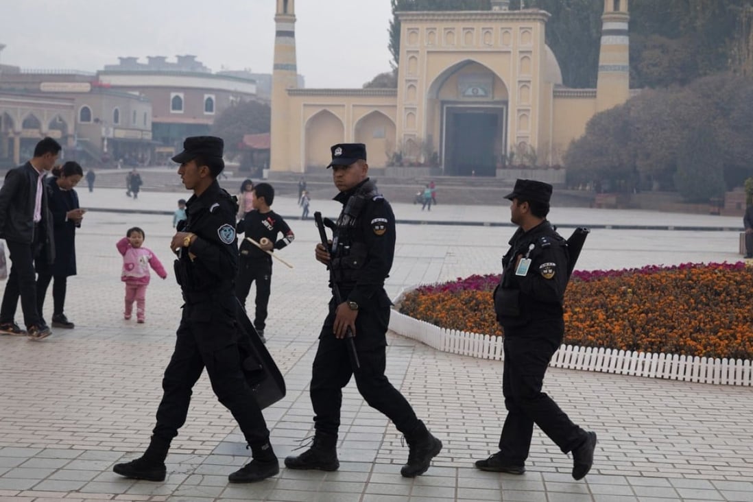 China’s Xinjiang region has revised a local law to allow local governments to “educate and transform” people influenced by extremism. Photo: AP