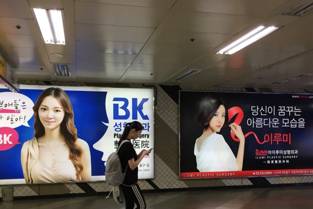 Plastic-surgery advertisements in the Seoul metro. Photo: Crystal Tai