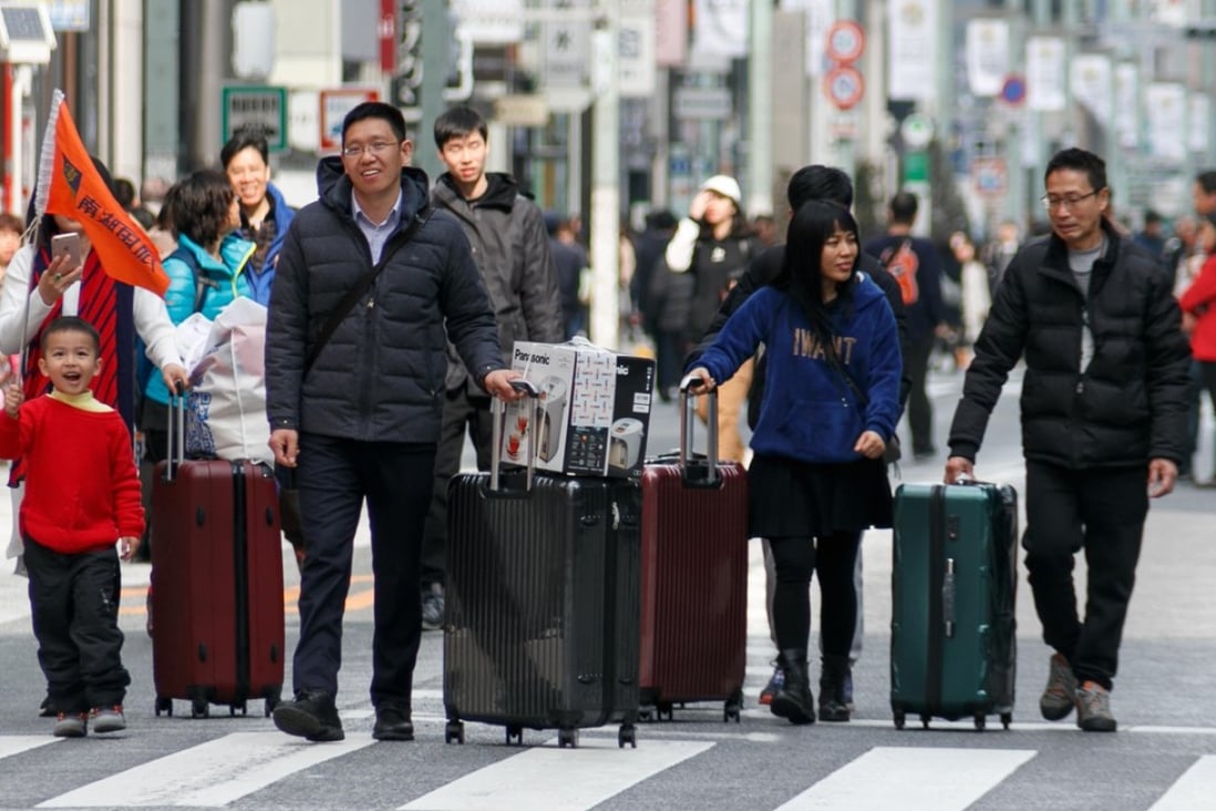 Tourists in the Ginza shopping area of Japan. Photo: AFP