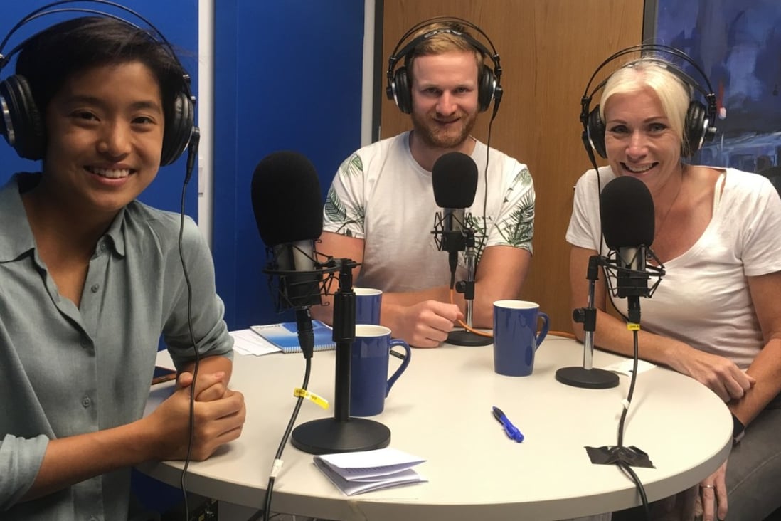 Mary Hui and Mark Agnew in the studio with triathlon coach Kate Rutherford. Photo: Jarrod Watt