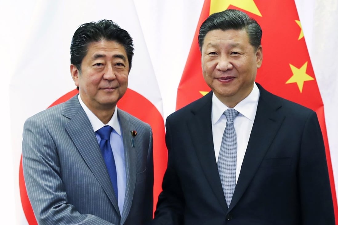 The visit of Shinzo Abe (left) is to feature meetings with Chinese leaders including President Xi Jinping. Photo: AP