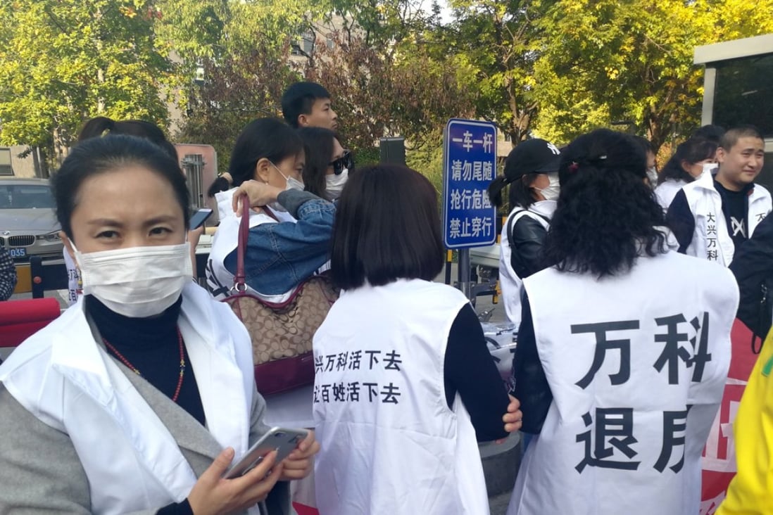 Protestors demanding they wanted to return their properties to Vanke, outside the company’s headquarters in Beijing last week. Photo: Yangpeng Zheng