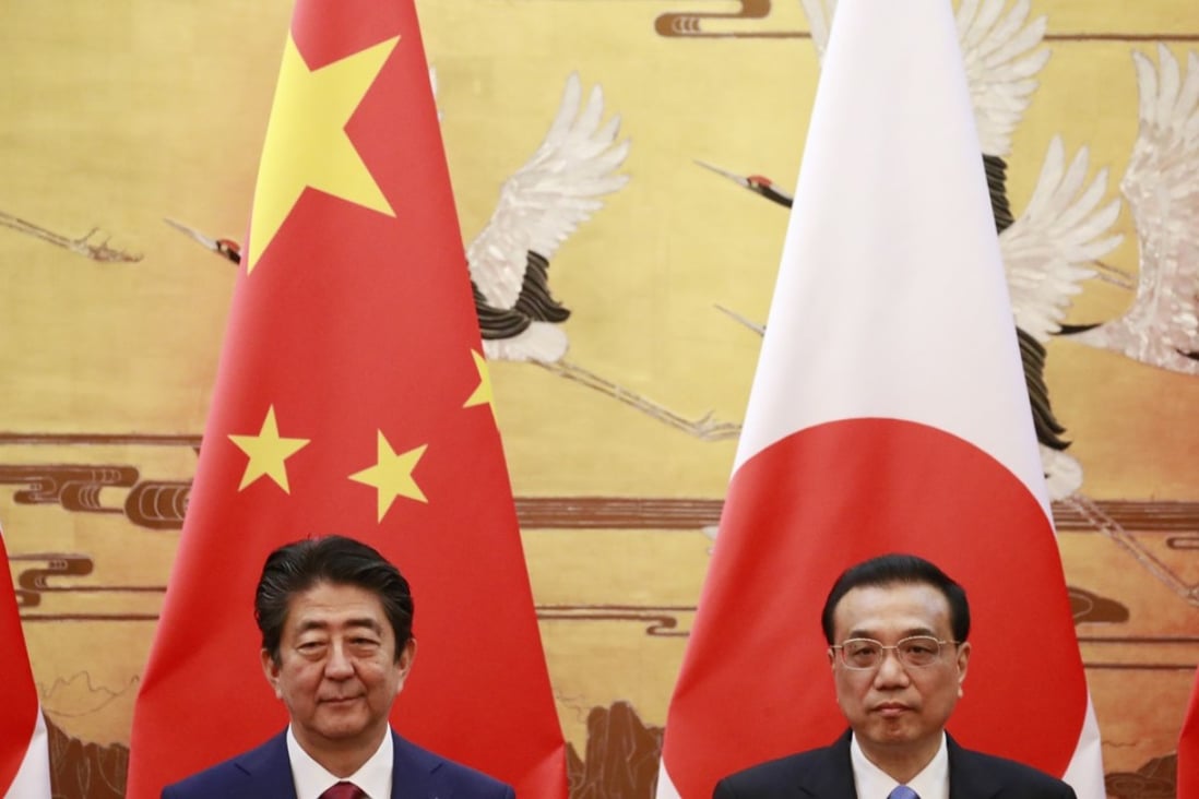 From left: Japanese Prime Minister Shinzo Abe and Chinese Premier Li Keqiang at a signing ceremony in the Great Hall of the People in Beijing on Friday. Photo: EPA