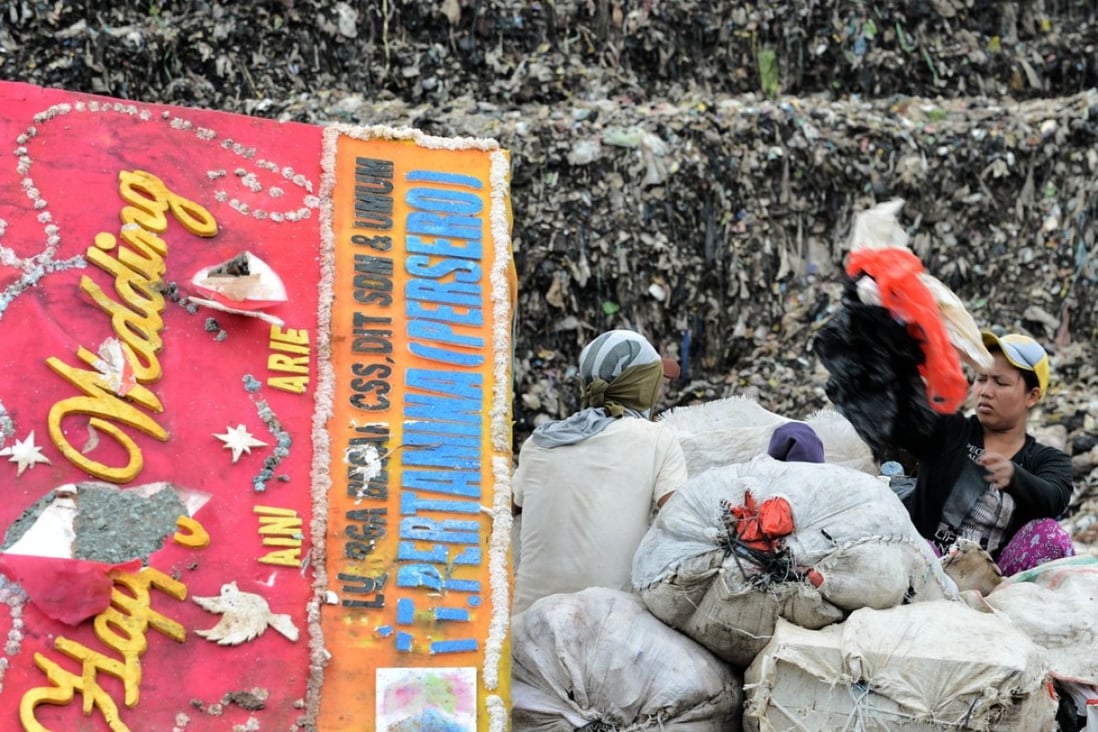 Scavengers sorting through a pile of waste at a dump area of Bantar Gebang. Photo: AFP