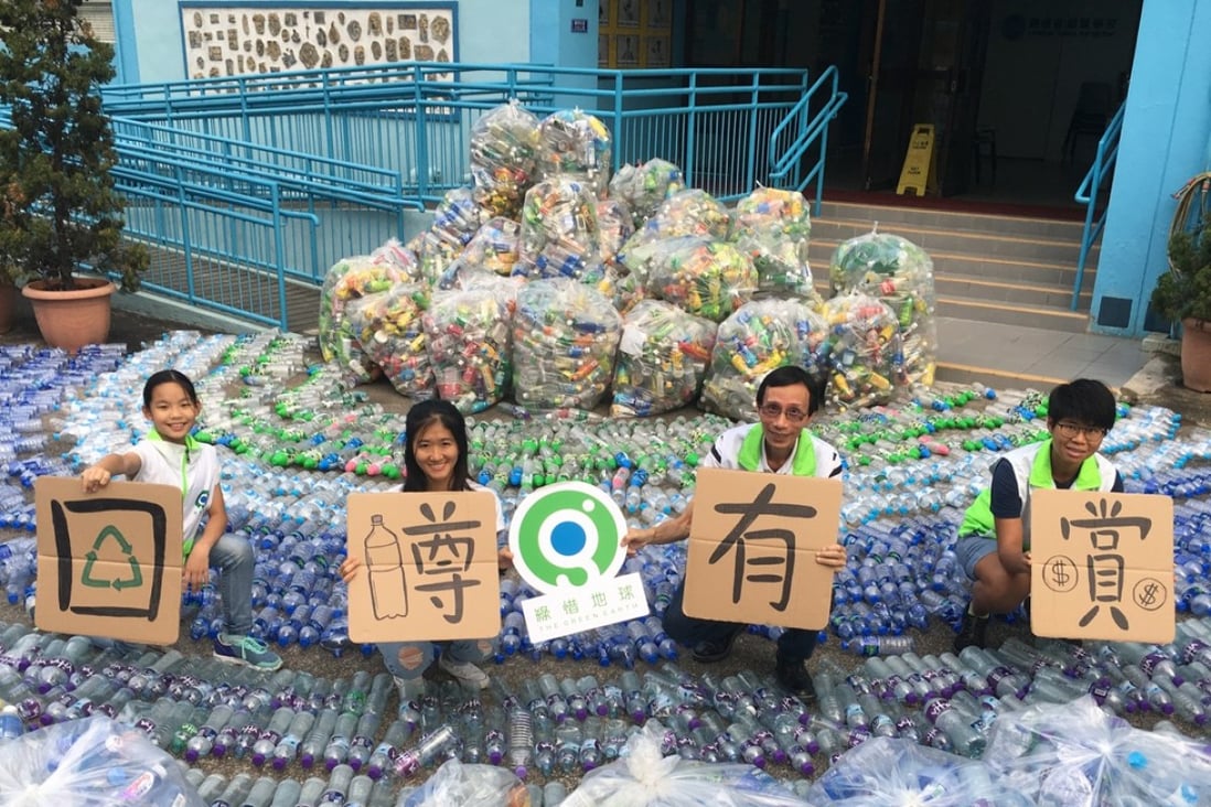 Green Earth staff and volunteers showing what they collected in a five-week trial scheme in which 20 HK cents were offered per returned plastic bottle. Photo: Handout.