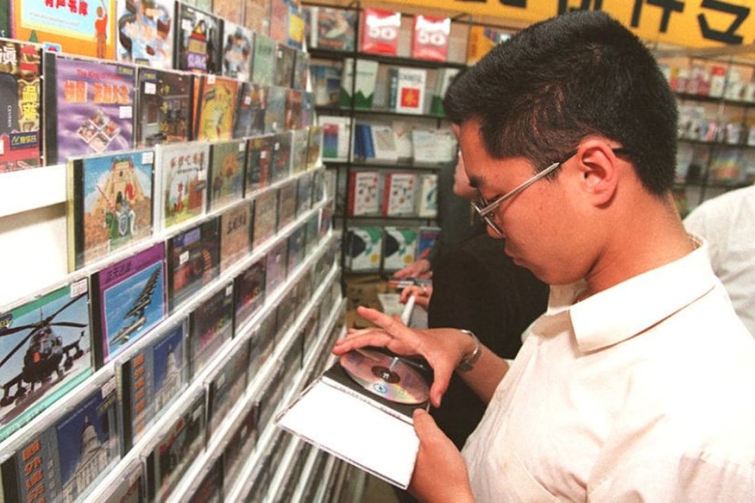 A man shops for Chinese-made computer software in Beijing, China, in 1996. Picture: AFP