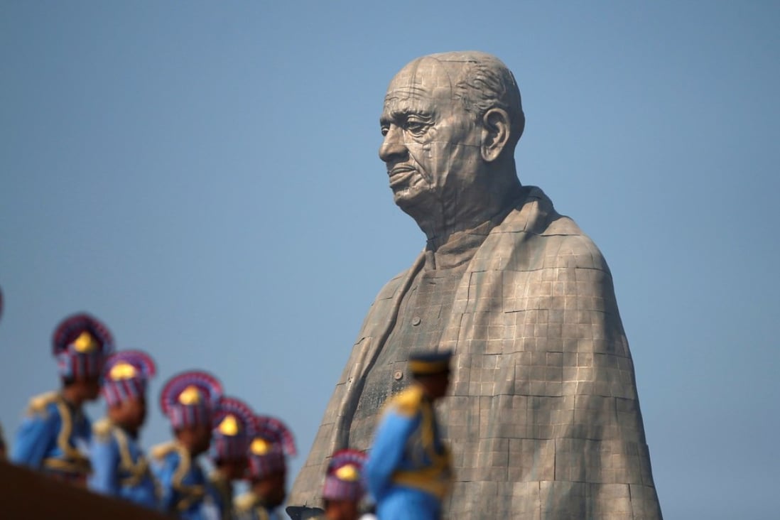 Police officers stand guard near the “Statue of Unity” portraying Sardar Patel, one of the founding fathers of India. Photo: Reuters