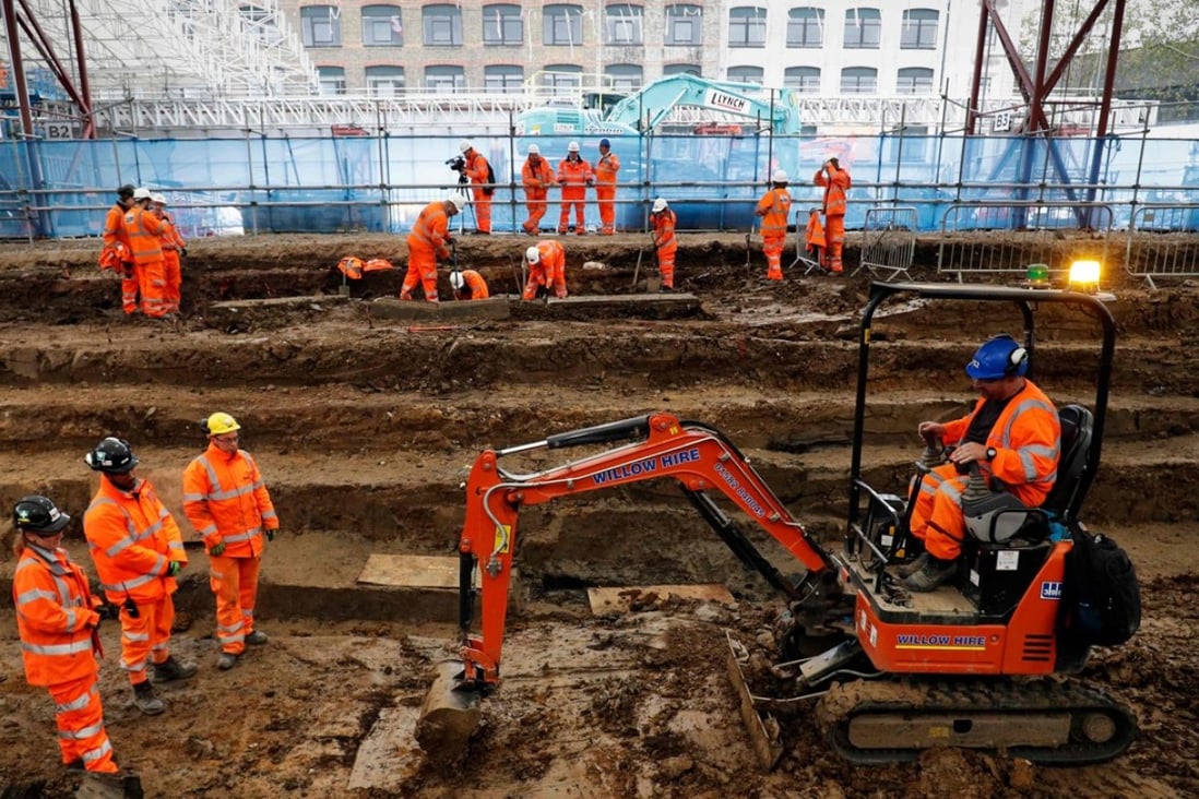 Field archaeologists carry out excavation works at the cemetery under St James Gardens near Euston railway station in London. Photo: AFP