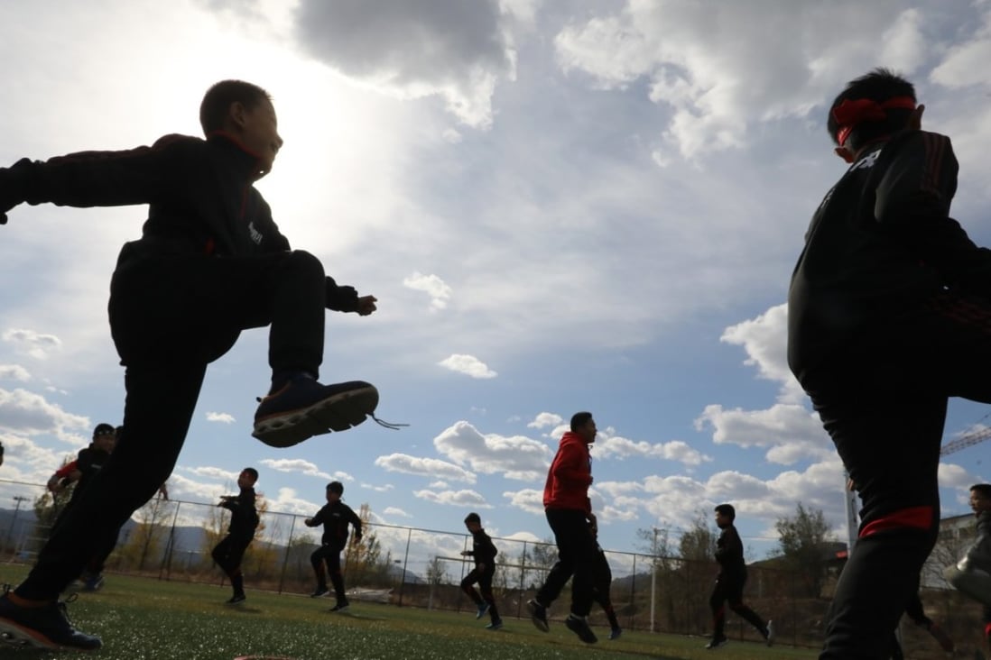 Boys take part in a physical training session at a school near Beijing. Photo: Simon Song