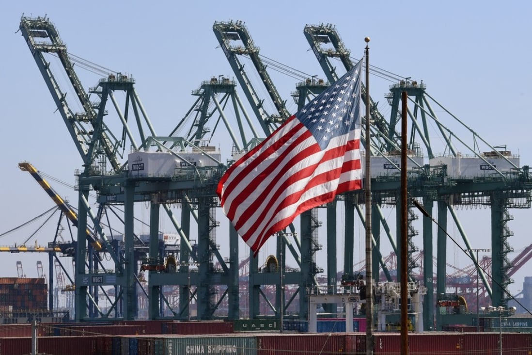 The US flag flies over Chinese shipping containers at the Port of Long Beach, in Los Angeles County, on September 29. Picture: AFP