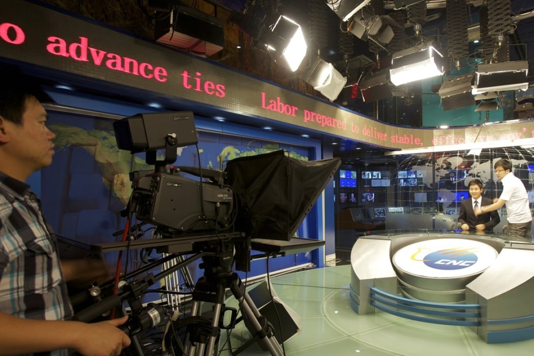 A news presenter rehearses in the CNC TV studio of Xinhua News Agency. Photo: on 8 September, 2010, Beijing, China. Photo: SCMP