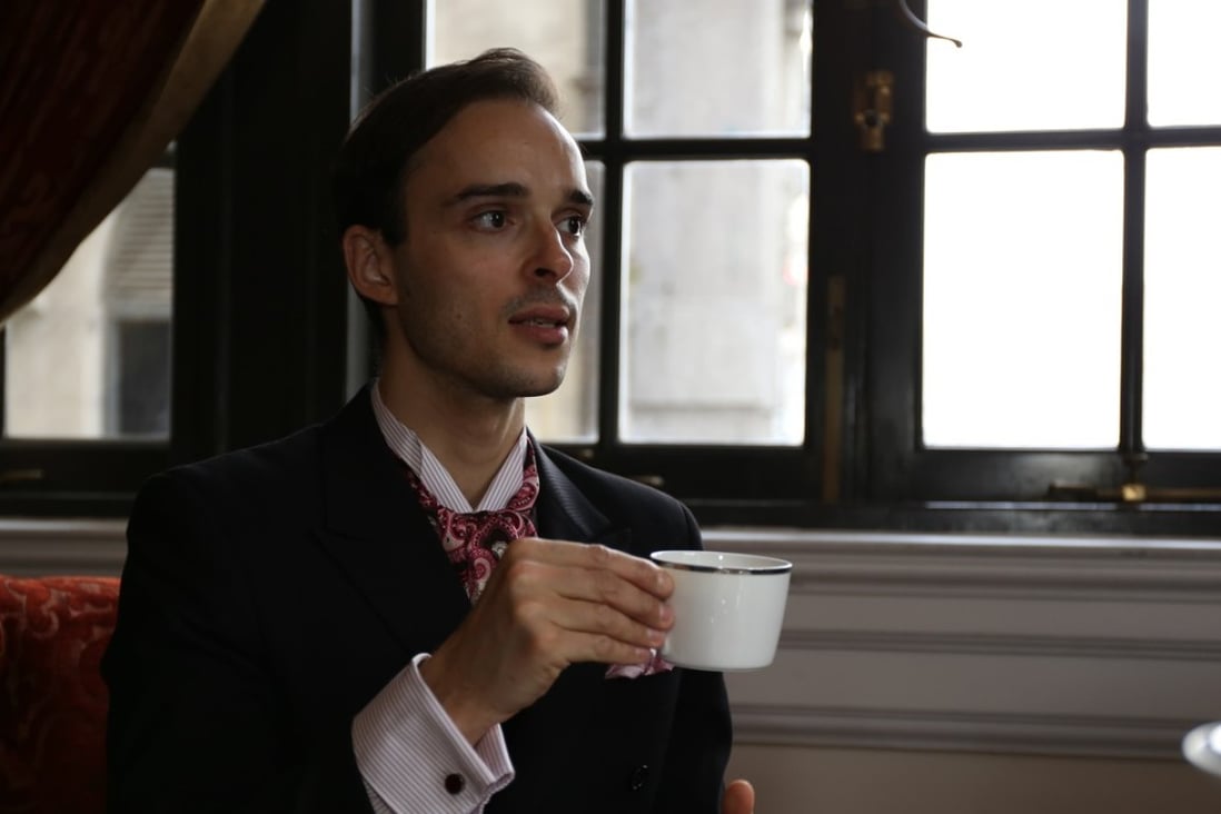 Guillaume Rué de Bernadac shows how to correctly hold a teacup at the Waldolf Astoria Shanghai.