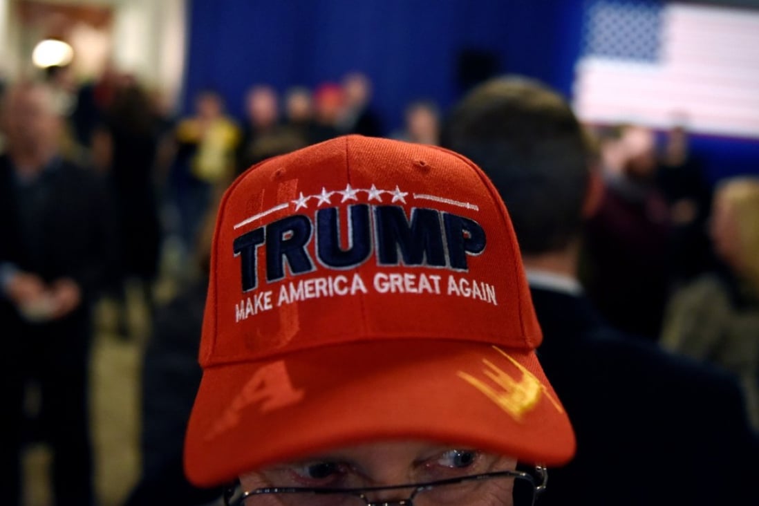 A Donald Trump supporter attends the election night party of Wisconsin’s Republican governor Scott Walker, who was narrowly defeated by Democrat Tom Evers in a race seen as a key test of partisan control in the Midwest. The Democrats may have regained the majority in the House of Representatives, but the Republican Party is now Trump’s to direct. Photo: Reuters
