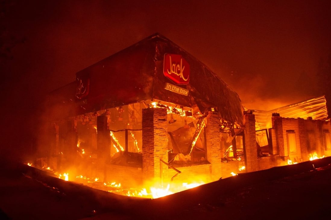 A Jack in the Box fast food restaurant burns as the fire tears through Paradise, north of Sacramento, California. Photo: Agence France-Presse