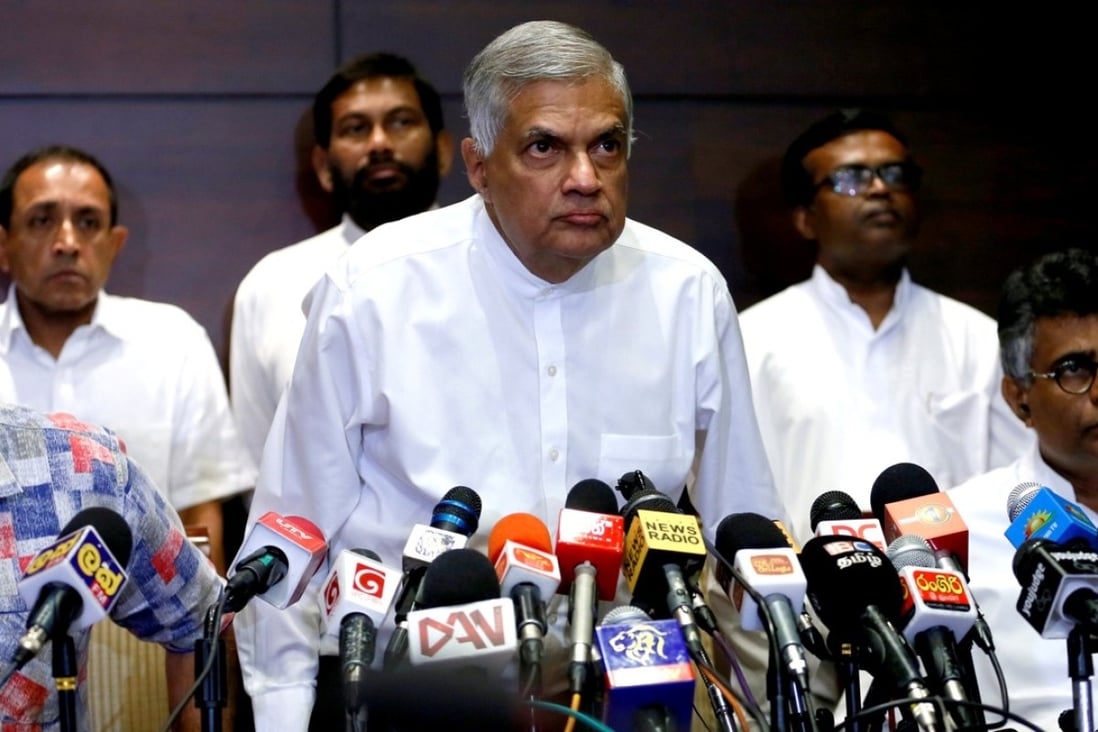 Sri Lanka's ousted Prime Minister Ranil Wickremesinghe arrives at a news conference in Colombo. His party has said it is ready for elections after the president dissolved parliament on Friday. Photo: Reuters