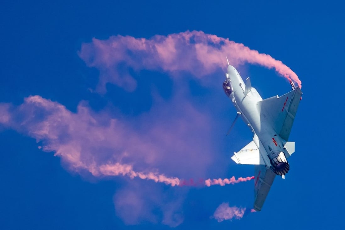 The PLA Air Force pilot shows visitors to Airshow China in Guangdong province what the latest engine developments can do in a J-10B TVC jet. Photo: Reuters