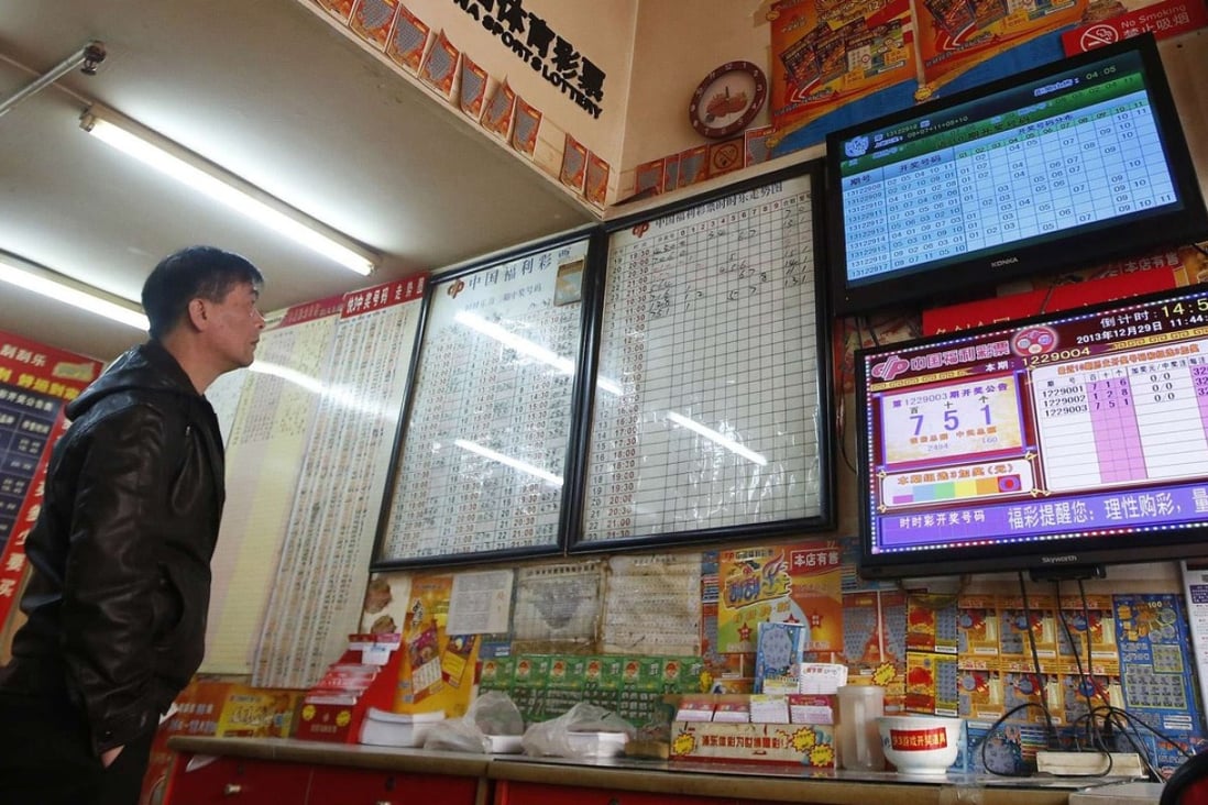 A customer at a Shanghai lottery story. The welfare and the sports lottery are the only legalised form of gambling on mainland China. Photo: Reuters