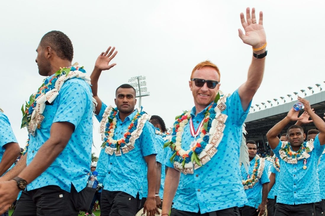 Ben Ryan and the Fijian team return home after winning Olympic sevens gold in Rio, 2016. Photo: AFP