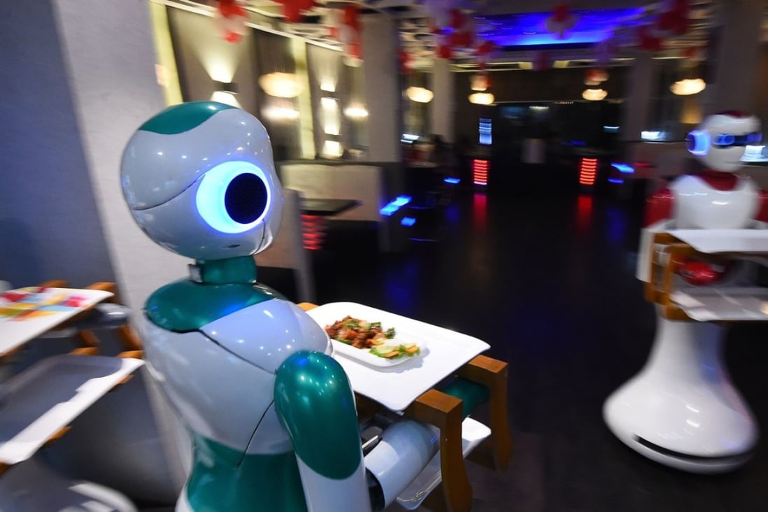 Robot waiters deliver food to customers at Naulo restaurant in Kathmandu. Photo: AFP