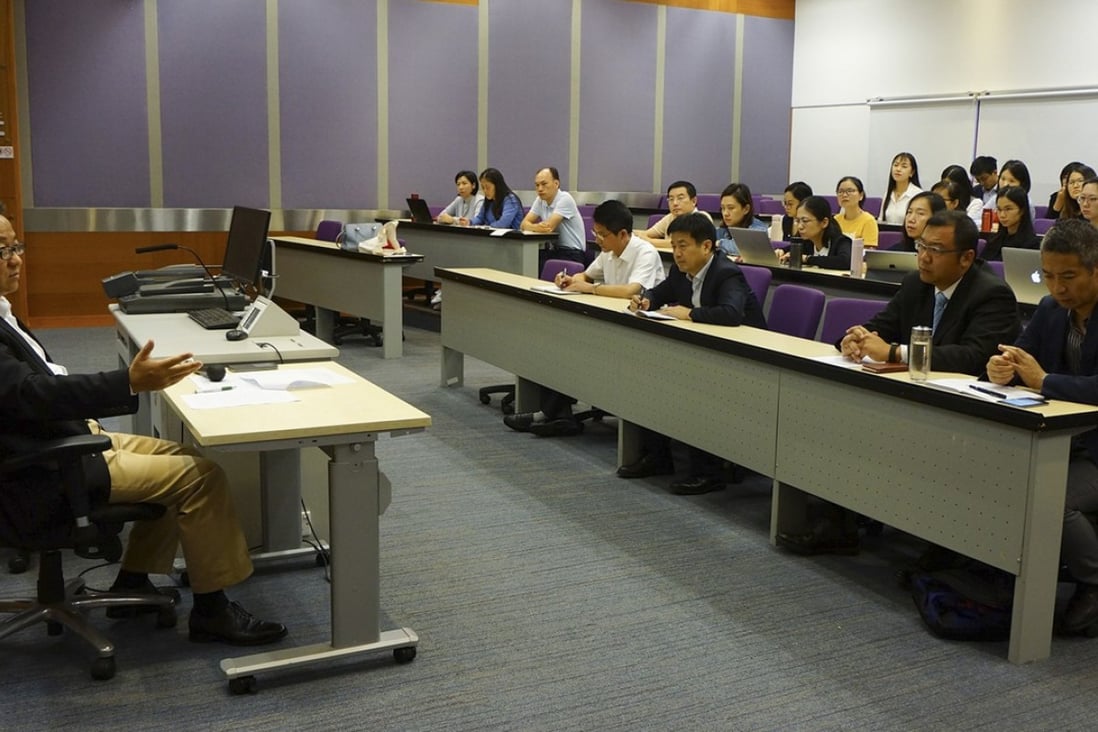 Huang Wenjun gives mainland judges a ‘party lecture’ at City University. Photo: National Judges College