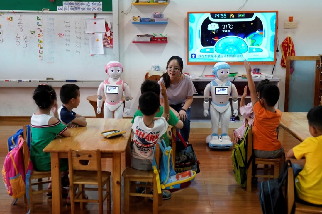 Humanoid robots are used to help teach children at a kindergarten in Suzhou, Jiangsu province. Photo: Reuters