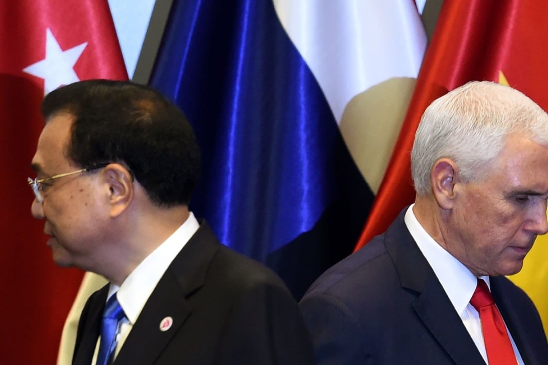 Chinese Premier Li Keqiang and US Vice-President Mike Pence leave the stage after posing for a group photo at the summit on Thursday. Photo: AFP