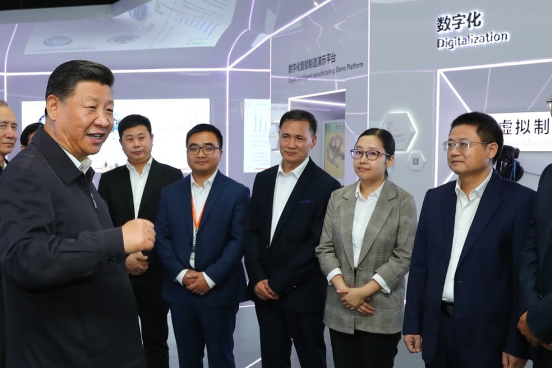 Chinese President Xi Jinping talking with the executives of middle and small-sized private enterprises at an automotive equipment company in Guangzhou on October 24. Photo: Xinhua