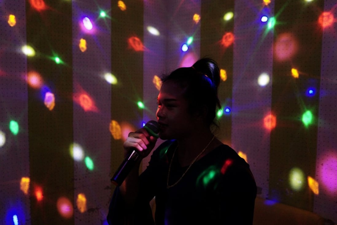 A transgender Muay Thai boxer at a karaoke room in Thailand. Photo: Reuters