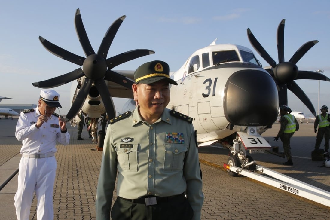Lt Gen Tan Benhong flew to the USS Ronald Reagan on Tuesday. Photo: AP