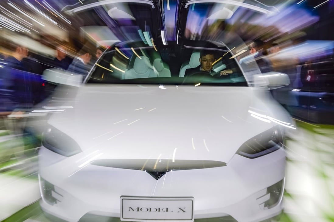 A visitor tries the Tesla Model X at the recent China International Import Expo in Shanghai. Photo: Xinhua