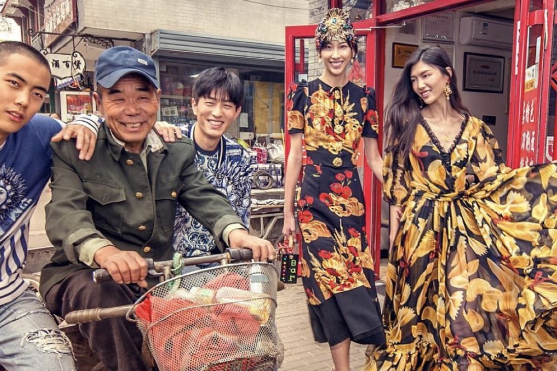This staged photo, taken from the D&G Instagram site, shows models wearing the brand’s clothing walking through Tiananmen Square in Beijing, interacting with locals. Photo: Handout