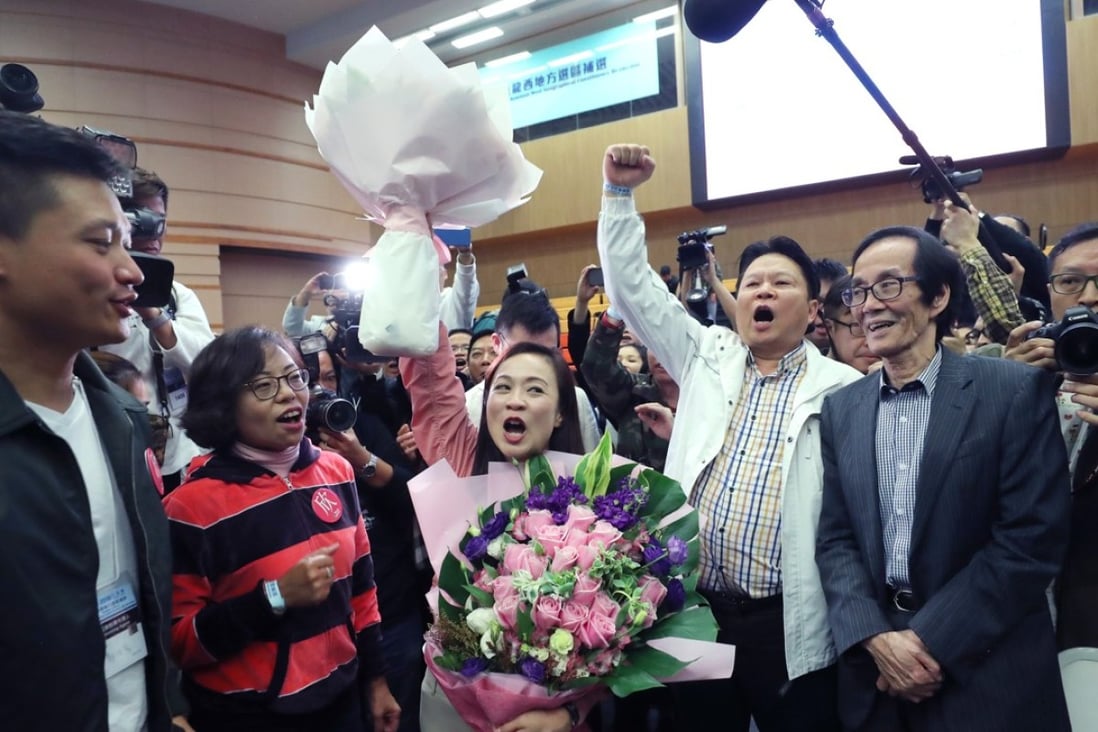 Lawmaker Vincent Cheng Wing-shun (left) and Alice Mak Mei-kuen (second left) celebrate Chan Hoi-yan’s (centre) victory. Photo: Sam Tsang