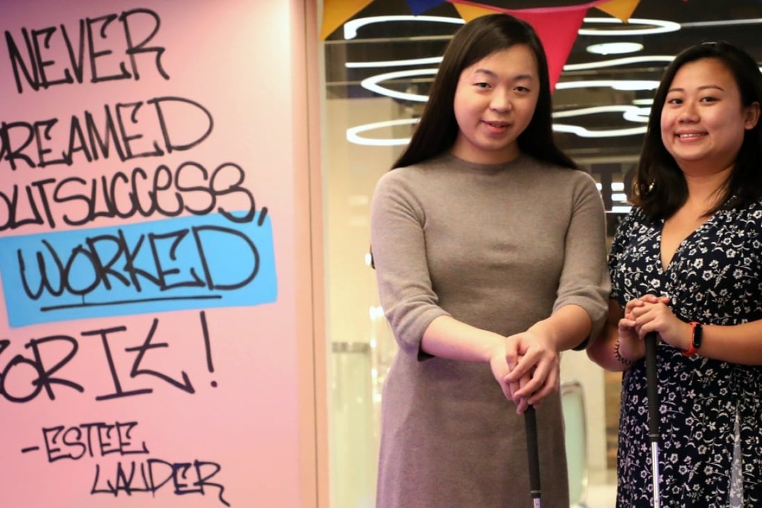 Jane Manchun Wong, 23 year old engineering student from UMass Dartmouth; Post reporter Zen Soo getting in a few rounds of mini-golf before stepping into the podcast studio. Photo: Felix Wong