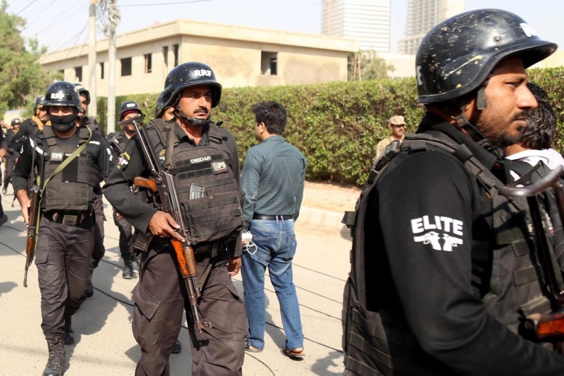Pakistani security personnel take position near the compound of the Chinese consulate in Karachi after it was stormed in an attack reportedly claimed by the Baloch Liberation Army. Photo: EPA
