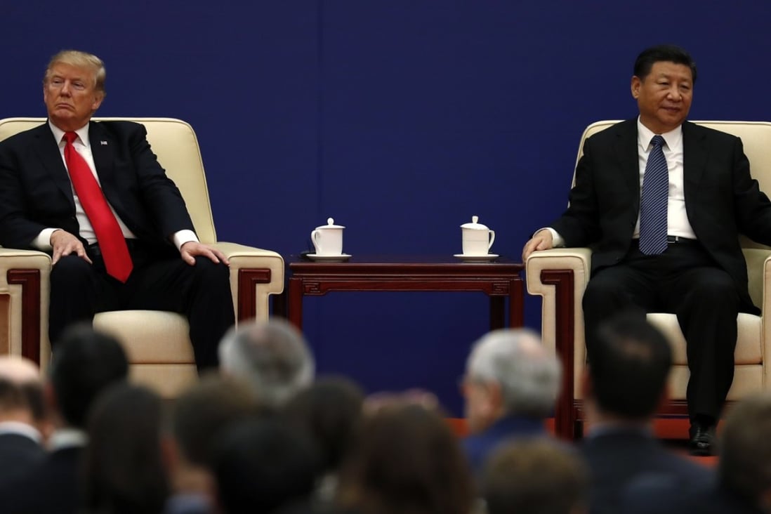 Donald Trump and Xi Jinping attend a business event in Beijing last year. The US president has turned up the heat in the trade war ahead of their meeting this week. Photo: AP
