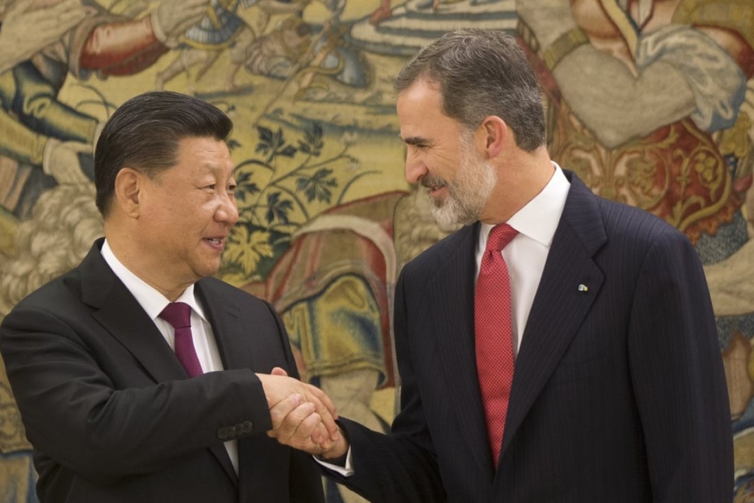 Chinese President Xi Jinping shakes hands with King Felipe of Spain in Madrid on Tuesday. Photo: AP
