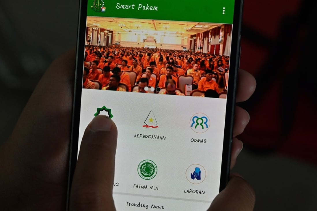 The new government app encourages users to report suspected acts of heresy. Photo: AFP